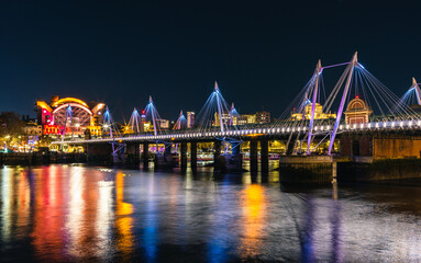 Night in London, Hungerford Bridge and Golden Jubilee Bridges over River Thames, London, England