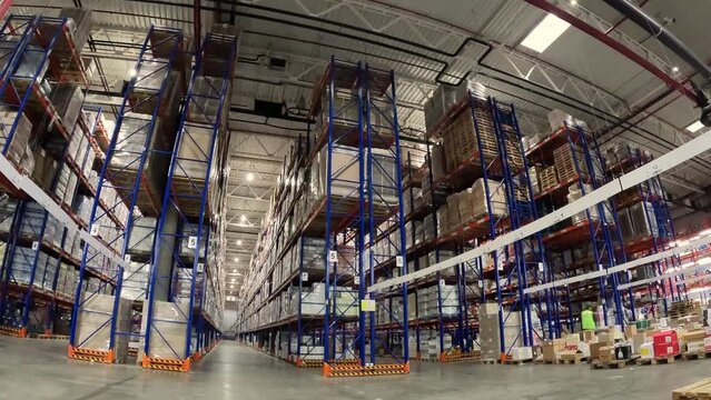 People work in a large warehouse. Timelapse in a modern warehouse. People work in a warehouse timelapse. Work with a modern warehouse