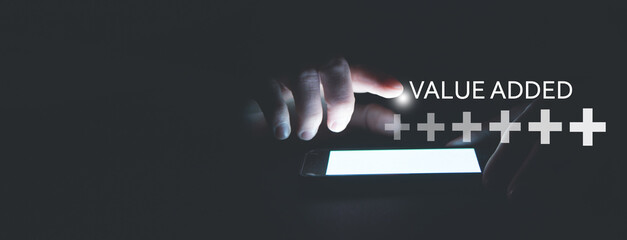 Human hand showing Plus symbols with a word Value Added. Profit, Benefit, Business