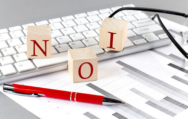 NOI word on wooden cubes and white background