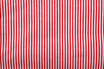 Red and white striped cotton texture. Fabric textile background