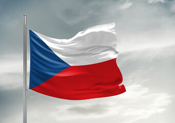 Czech Republic national flag cloth fabric waving on beautiful sky Background.
