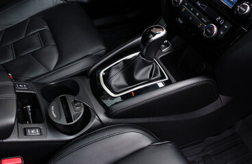Close up of the automatic gearbox lever, black interior car, Automatic transmission gearshift...