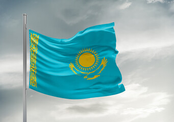 Kazakhstan national flag cloth fabric waving on beautiful sky Background.