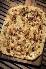 Flammkuchen tarte flambee rectangular pizza with bacon and chicken