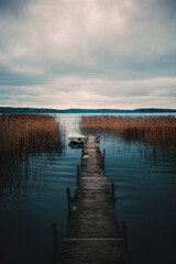Vertical shot of an old pier by the Vittrask lake in Kirkkonummi, Finland on a gloomy day