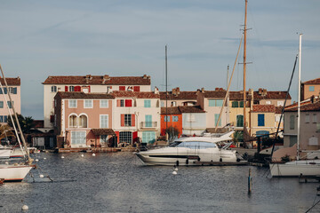Port Grimaud, France - 28.12.2021 :  View of the beautiful facades of Port Grimaud on the French Riviera on a sunny winter day