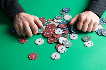 person grab casino playing chips as the symbol of winning of jackpot - obrazy, fototapety, plakaty