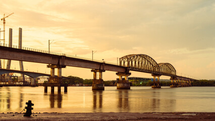 Fototapeta na wymiar Beautiful view of the Zuari Railway Bridge during sunrise