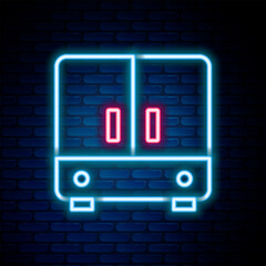Glowing neon line Wardrobe icon isolated on brick wall background. Colorful outline concept. Vector