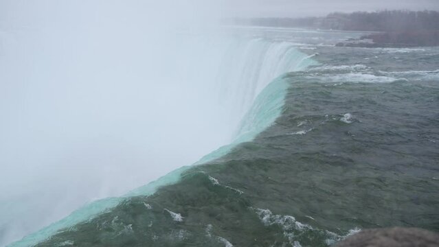 Gorgeous view of the Niagara Falls from a stone tower in Ontario, Canada