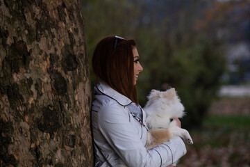 Portrait of a young adult woman with a dog