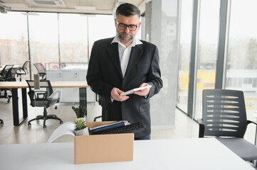 Fototapeta premium Stressed retire man leaving his office
