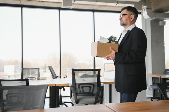 Old businessman employee in relocation concept