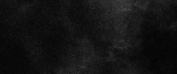 Abstract splashes of water on black background. Freeze motion of white particles, abstract splashes of milk on a black background, dust overlay textured. Grain noise particles. Snow effects pack. 
