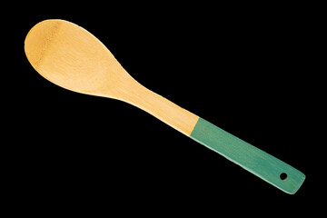 One wooden kitchen spoon isolated on black background, macro, top view.