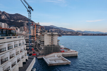 Monaco, Monaco - 28.12.2021 : Construction of new quarters in Monaco with the help of a superstructure on the sea