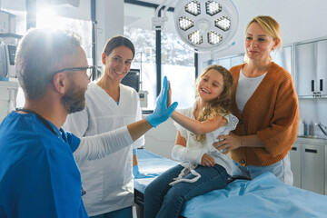 Little girl with her mother in surgery examination.