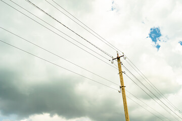 Power electric pole with line wire on colored background close up