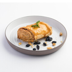 Beautiful shot of tasty sweet rolls with walnuts, raisins and sugar