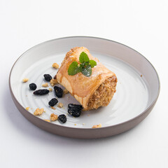 Beautiful shot of tasty sweet rolls with walnuts, raisins and sugar