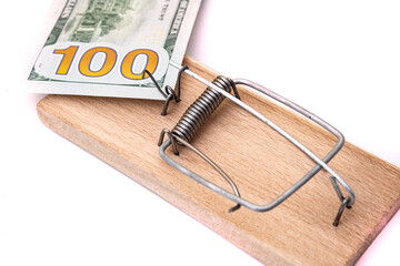 Many banknotes in mouse trap on the white background