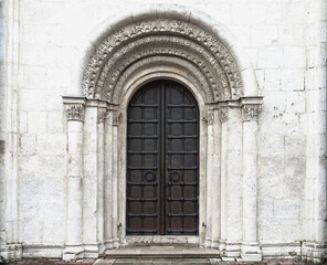 Fototapeta na wymiar Antique wrought iron entrance door to an ancient temple.