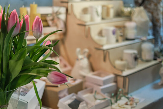 blurred backdrop of a beautiful market stall filled with handcrafted items at a seasonal fair. Springtime events and celebrations, outdoor markets and festivals