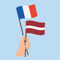 Flags of France and Latvia, Hand Holding flags