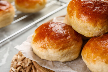 Tasty scones prepared on soda water on grey marble table, closeup
