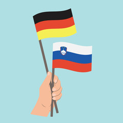 Flags of Germany and Slovenia, Hand Holding flags