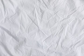 Crumpled white fabric as background, top view