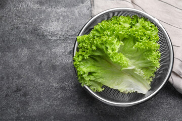 Fresh lettuce on stone table, top view. Space for text