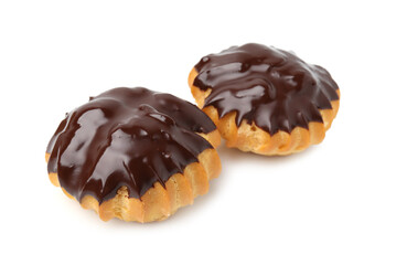 Delicious profiteroles with chocolate spread isolated on white