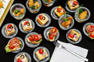Various event snacks in the glasses, Top view.