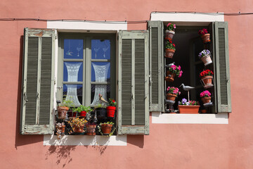 Fototapeta na wymiar Closeup shot of beautiful windows decorated with vases