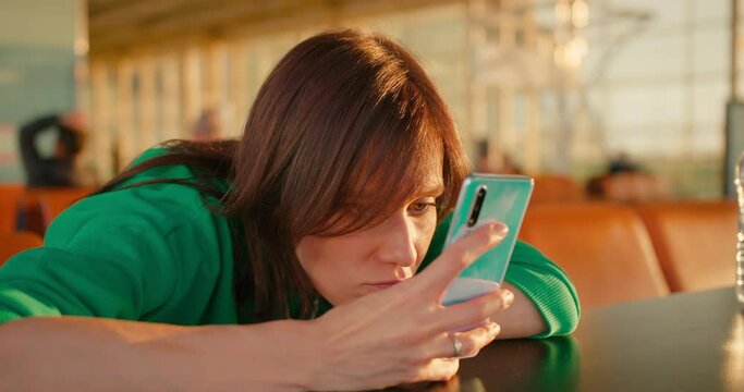 Bored woman waits for delayed flight at terminal airport. late to connection flight