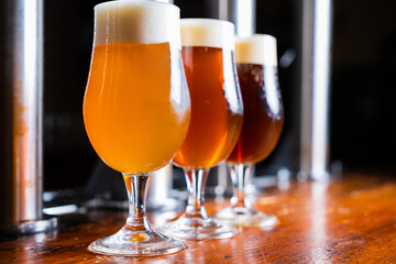 Glasses of light and dark beer on a pub background. draft beer, craft beer, imported beer