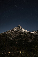 Vertical shot of the volcano of Colima in the starry night