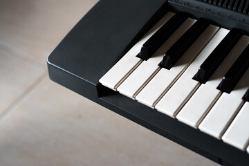 Closeup of a detail of black and white piano keys