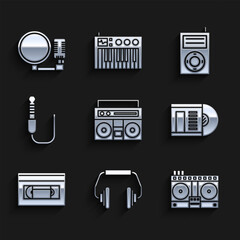 Set Home stereo with two speakers, Headphones, DJ remote for playing and mixing music, Vinyl disk, VHS video cassette tape, Audio jack, Music MP3 player and Microphone icon. Vector