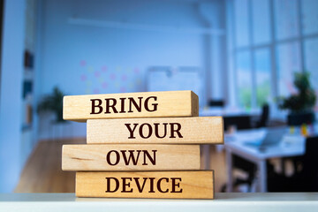 Wooden blocks with words 'bring your own device'.