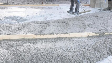 During construction of new house concrete mixing truck was used to pour concrete for pavement around home