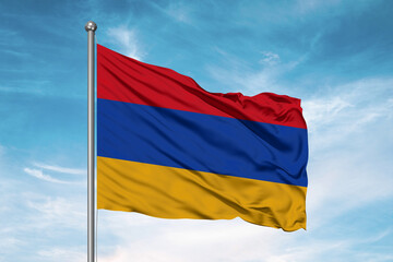 Armenia national flag cloth fabric waving on beautiful sky Background.