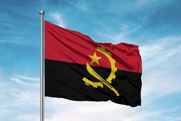 Angola national flag cloth fabric waving on beautiful sky Background.