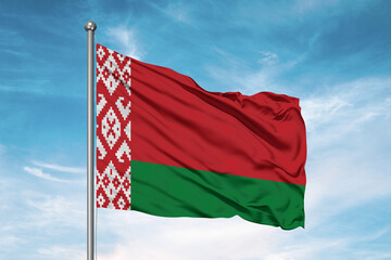 Fototapeta na wymiar Belarus national flag cloth fabric waving on beautiful sky Background.