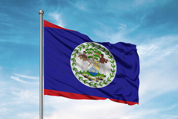 Belize national flag cloth fabric waving on beautiful sky Background.
