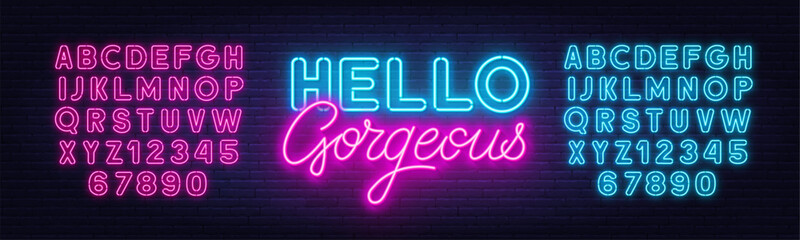 Hello Gorgeous neon quote on brick wall background.