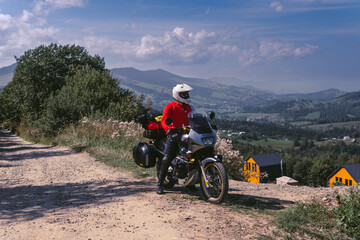 Motorbiker travelling, summer day, motorcycle off road, the driver with adventure, touring...