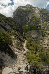 Fototapeta na wymiar Narrow Trail Cut Into The Cliff Side In Backcountry of Yosemite